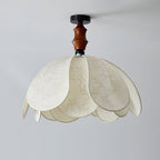 The Savoy Ceiling Light illuminated in a contemporary living room.
