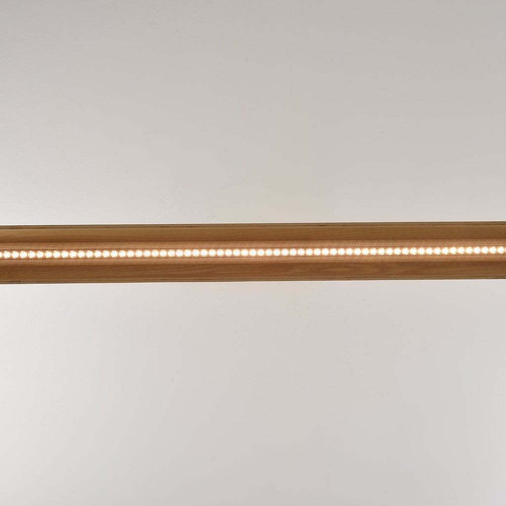 The 180cm version of the chandelier spanning a large table.