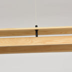 The chandelier's reflection on a glossy tabletop.